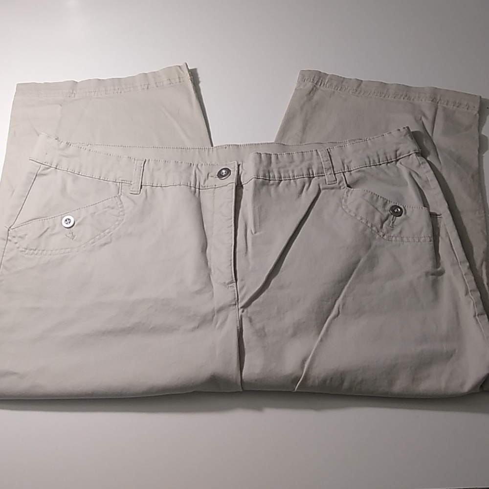 Tan capris with button detail at the cuff.